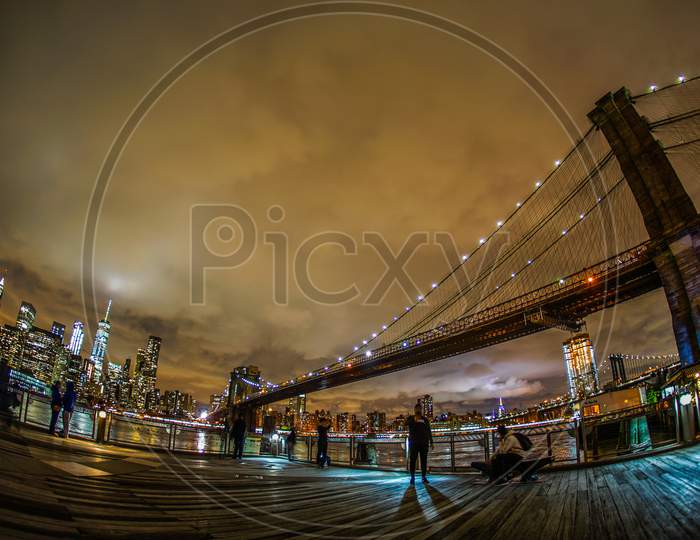 Night View And People Of Manhattan And Brooklyn Bridge