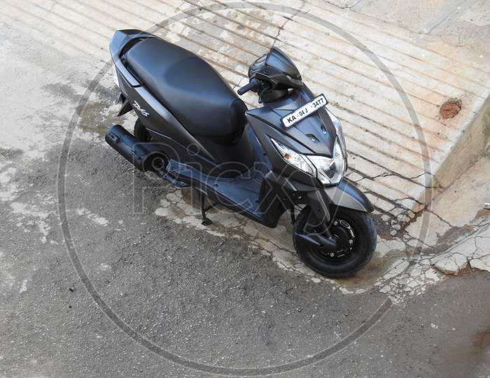 Image of Closeup Of Black Color Honda Dio Bs6 Mileage Bike Parking On Roadside Top Angle View BE247324 Picxy