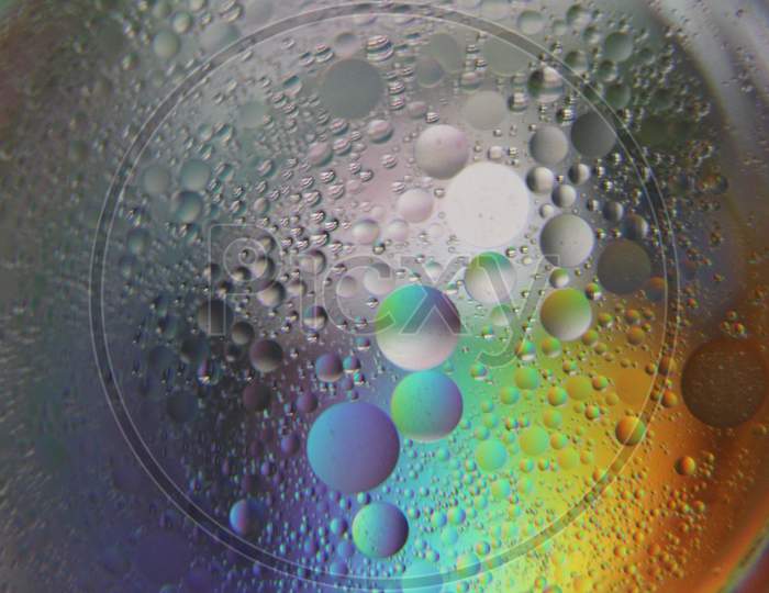 Close view of oil bubble. Macro of colorful oil bubble. Beautiful background of oil bubble.