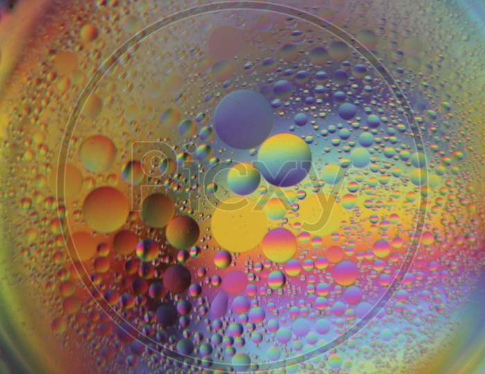 Close view of oil bubble. Macro of colorful oil bubble. Beautiful background of oil bubble.