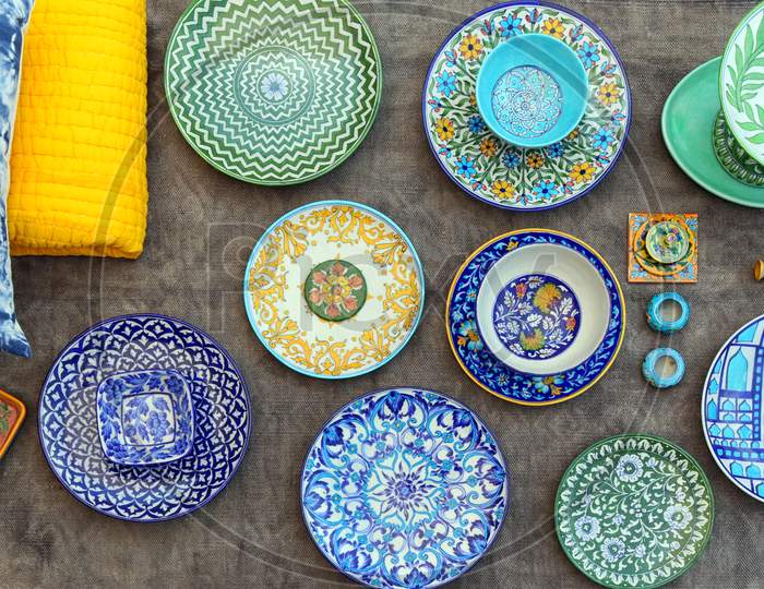Flat-lay of blue pottery plates in Jaipur. Blue pottery art.