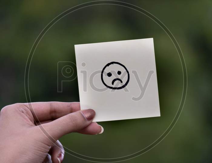 Emoji Or Drawing Of Happy Expression Face On Blank Note Pad Or Sticky Notes.