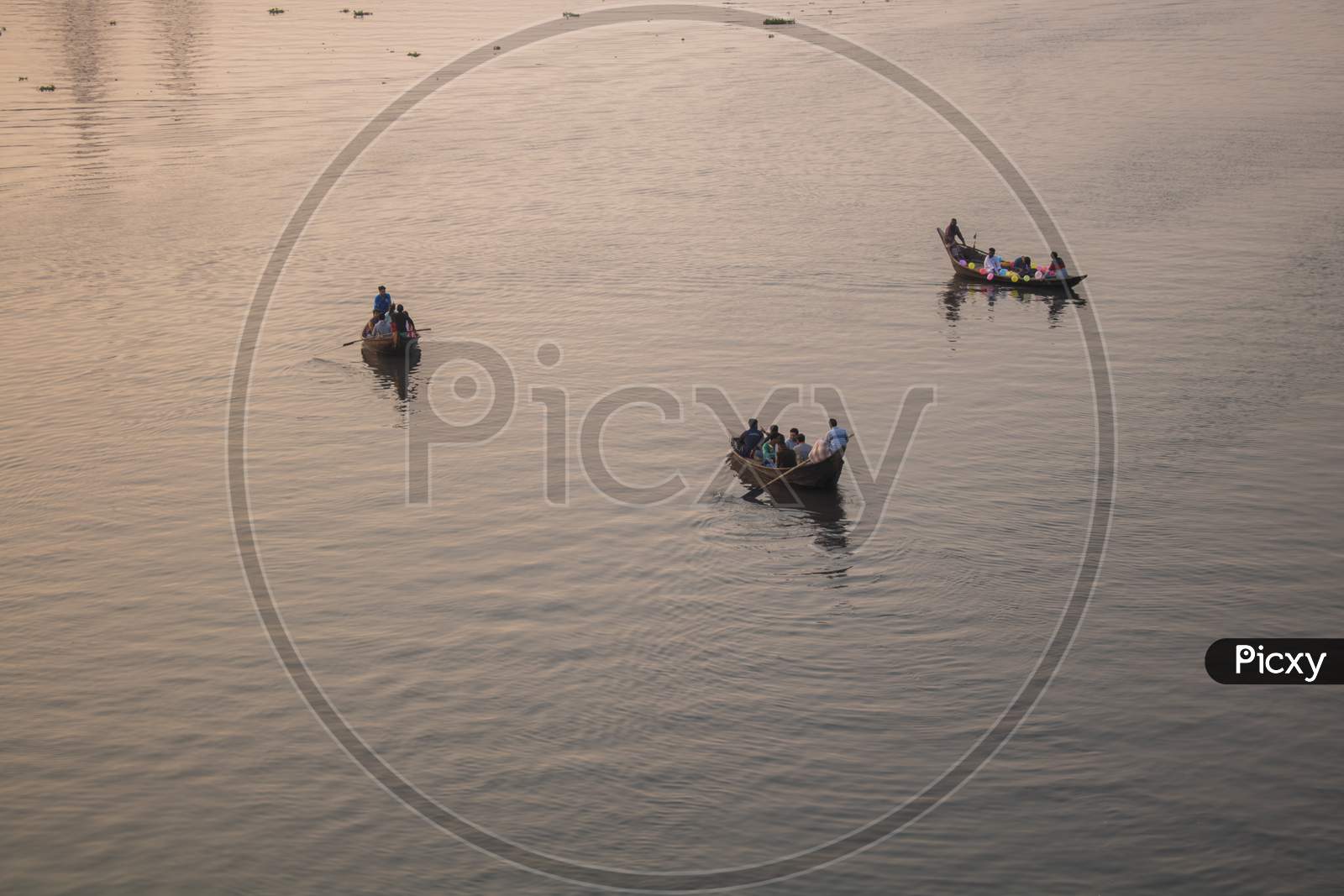 The Boat Is Floating In The Golden Light Of The Afternoon. This Is A View Of The River Buriganga In Bangladesh.