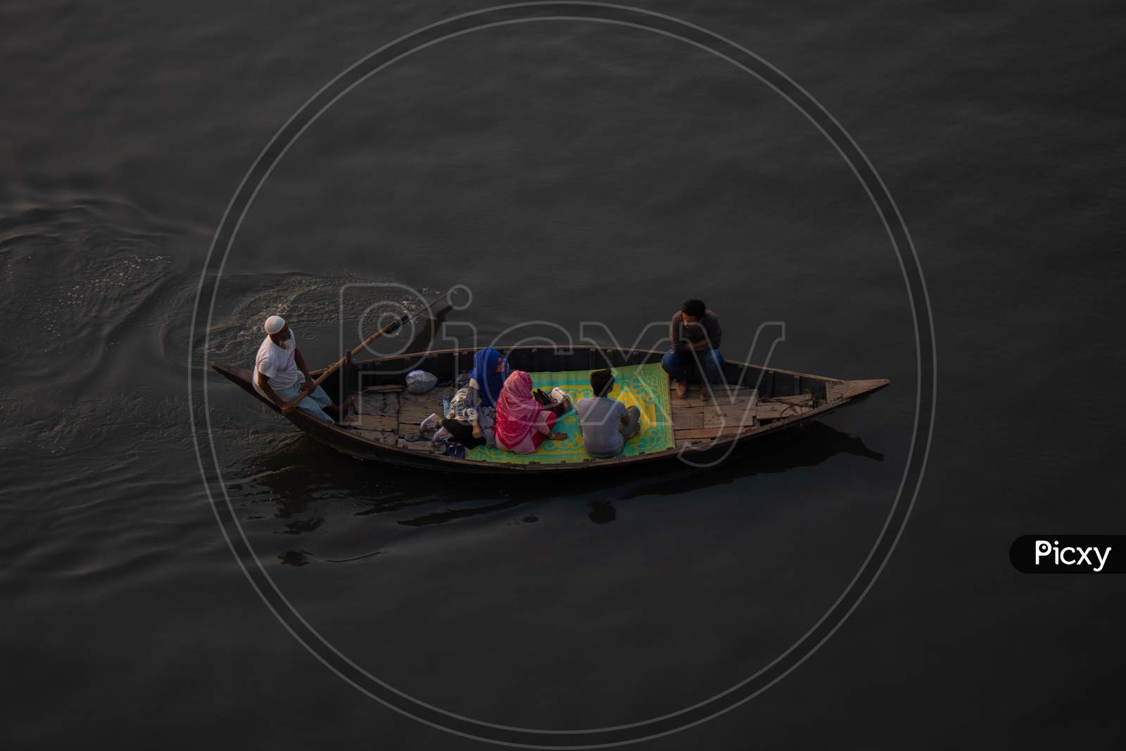 The Couple Is Cruising In The River. The Boat Is Floating. This Is A View Of The River Buriganga In Bangladesh.