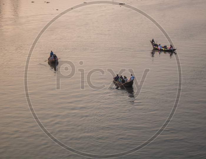The Boat Is Floating In The Golden Light Of The Afternoon. This Is A View Of The River Buriganga In Bangladesh.