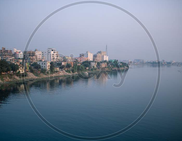 Picture Of One Side Of Dhaka City On The Banks Of River Buriganga.The River Buriganga Has Enhanced The Beauty Of The Capital City Dhaka.