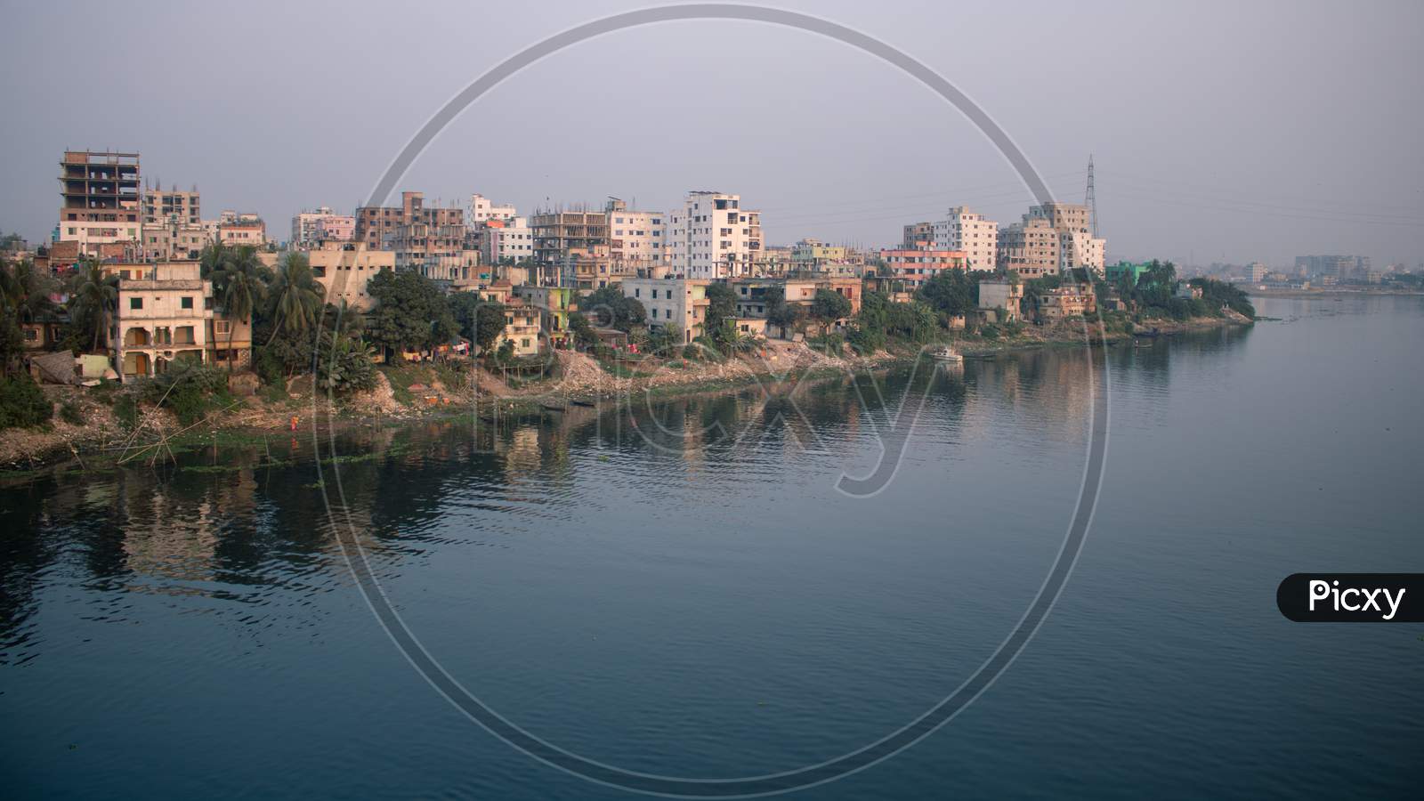 Picture Of One Side Of Dhaka City On The Banks Of River Buriganga.The River Buriganga Has Enhanced The Beauty Of The Capital City Dhaka.
