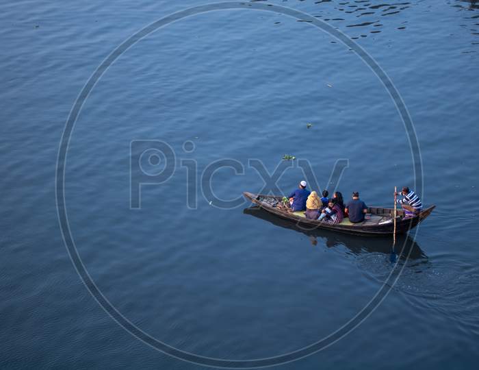 Everyone Is Taking A Boat Ride On The River Buriganga Near The Capital City.