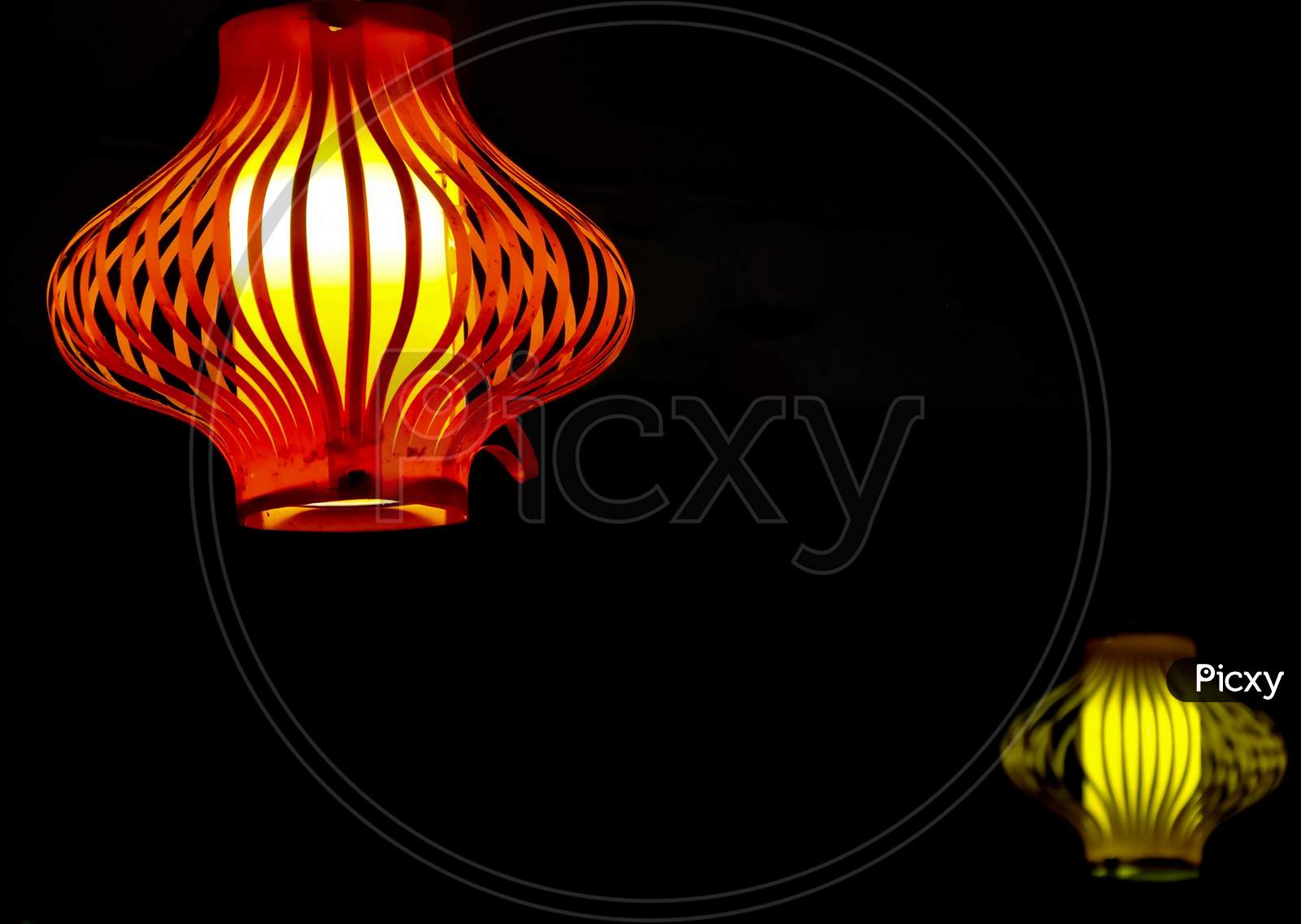 Colorful ceiling lamp light with black background and copy space