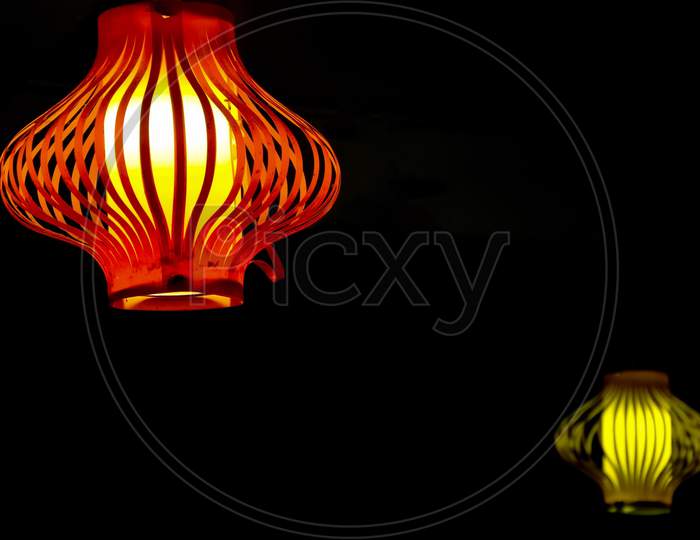Colorful ceiling lamp light with black background and copy space