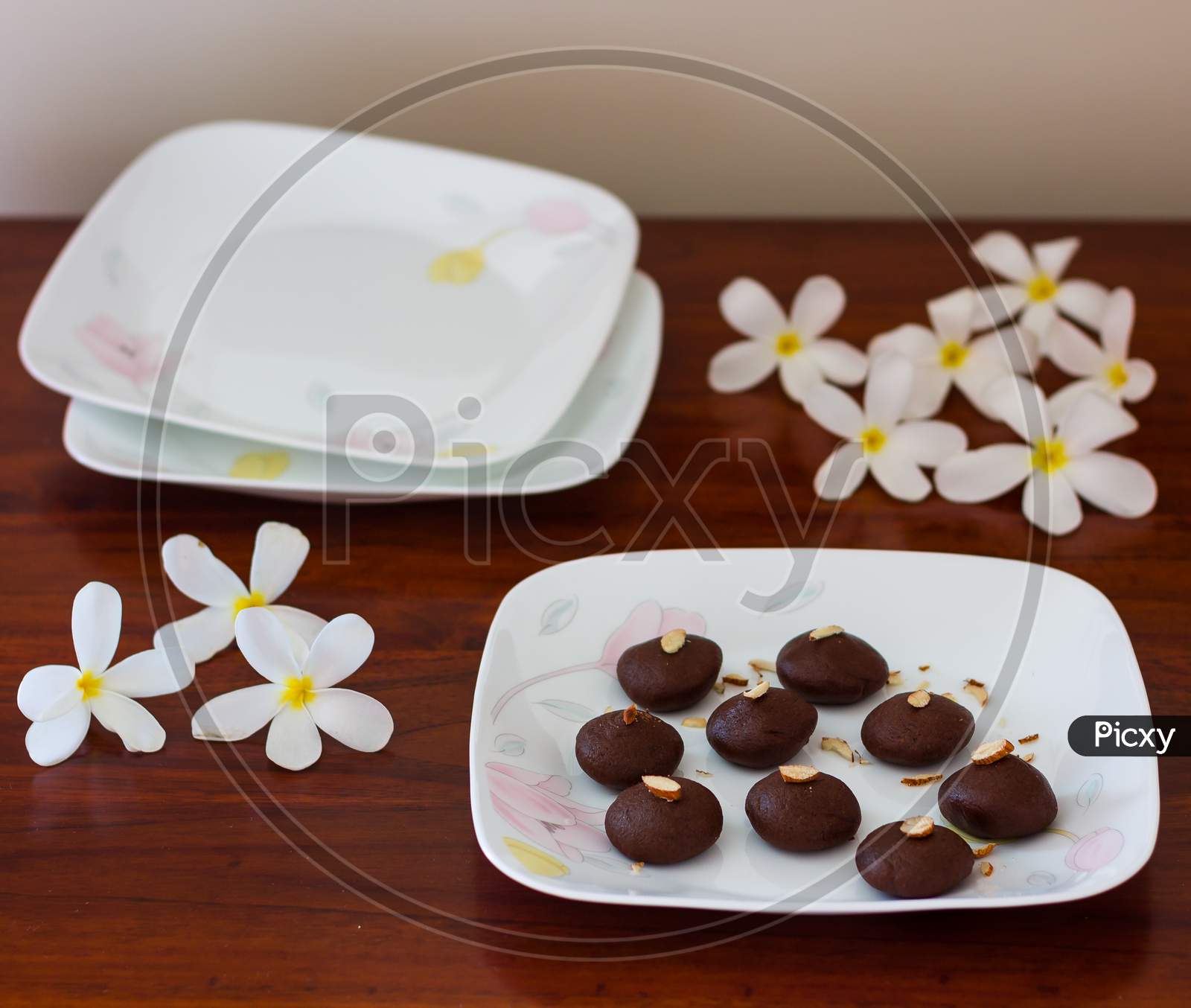 Selective focus on Dark Chocolate truffle or cocoa balls or pralines or candies,isolated on dark background,blur background.Also an Indian dessert called chocolate peda,pedha made during Dussehra.