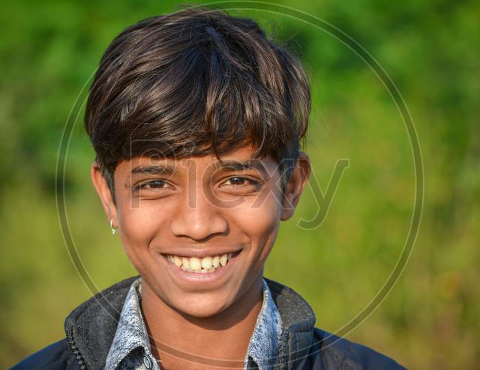 TIKAMGARH, MADHYA PRADESH, INDIA - SEPTEMBER 28, 2021: An handsome Indian boy smiling at the camera.