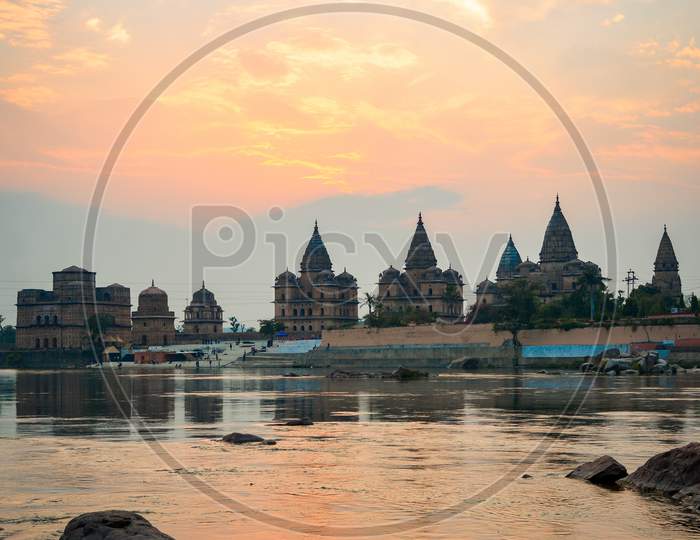 Cenotaphs (Chhatris) on the bank of the Betwa River at sunset
