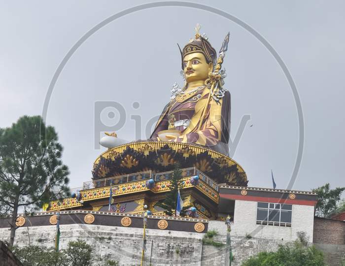 Low angle view of massive statue of Padmasambhava (Guru Rinpoche) in Rewalsar lake (Tso Pema), Himachal Pradesh, India