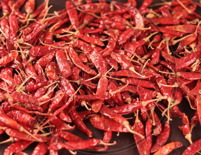 Pile Of Dried Red Chili Pepper As A Food Background With Chili Pepper Powder In Bowl,Smoked Red Paprika Spicy With Chili Powder,Crushed Red Chili Pepper With Dry Red Chili
