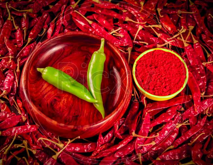 Hot Spice Chili Pepper Family,Traditional Indian Chili Pepper Paste In Bowl Or Spoon With Dried Peppers On Wooden Table, Green And Dried Chili,Dried And Crushed Fruits Of Capsicum Frutescens