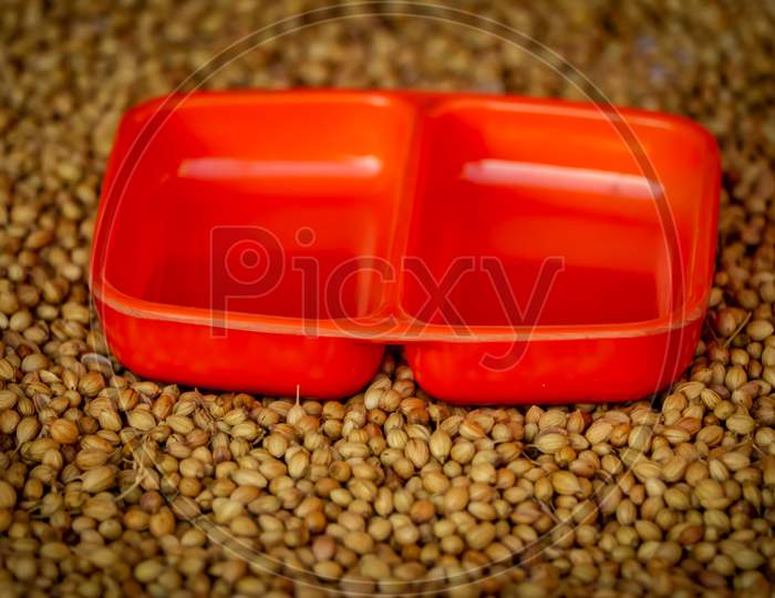 Coriander Seeds In A Big Wooden Bowl, Coriander Seeds And Wooden Spoon Beautiful Footage,Raw Organic Coriander Seeds In A Bowl,Selective Focus On Subject,Dried Coriander Seed Bowl