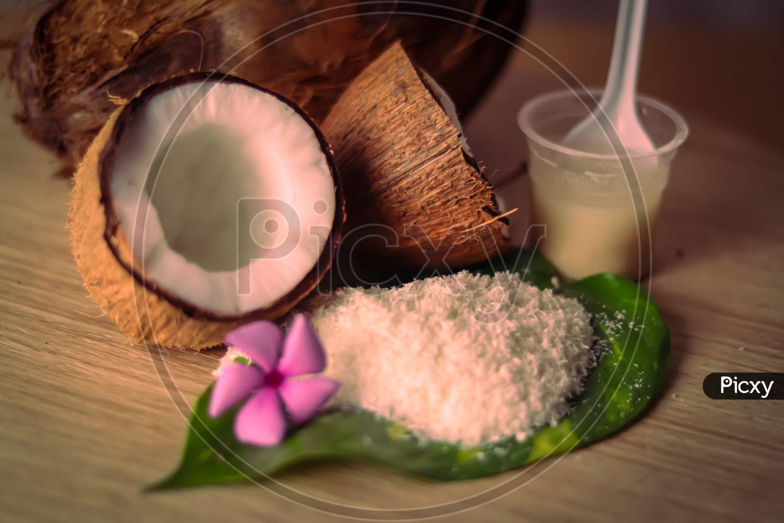 White Coconut And Coconut Powder On Green Leaves Beautiful View,Hd Footage Of Fresh Coconut Family,Healthy Ingredients,Selective Focus On Subject,,Selective Focus On Subject,