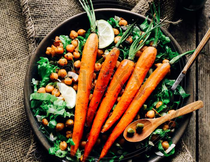 Baked carrots on a chickpeas salad