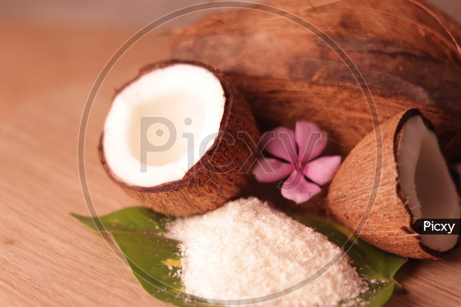 White Coconut And Coconut Powder On Green Leaves Beautiful View,Hd Footage Of Fresh Coconut Family,Healthy Ingredients,Selective Focus On Subject,