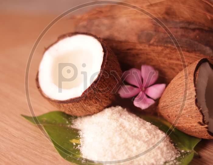 White Coconut And Coconut Powder On Green Leaves Beautiful View,Hd Footage Of Fresh Coconut Family,Healthy Ingredients,Selective Focus On Subject,
