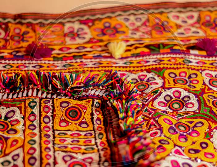 Handwork Embroidery,Handmade Embroidery Art. Traditional Indian Handmade Embroidery Art,Selective Focus,Mirror Work Colorful Handmade Ahir Bharat,Kutch-Gujarat