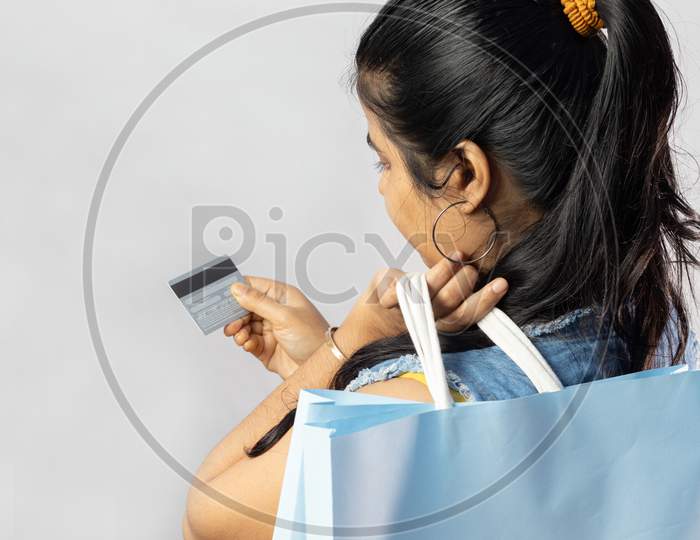 Woman With Shopping Bags And Credit Card