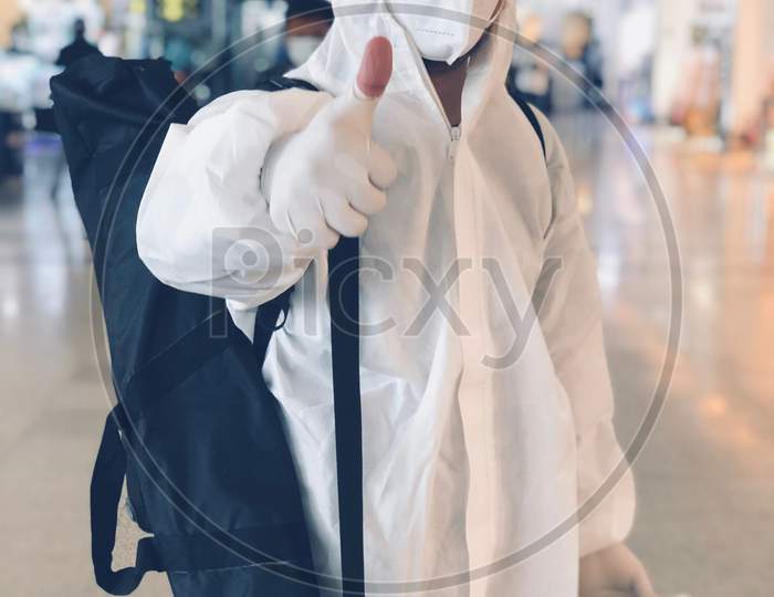 Man travelling in PPE Kit during pandemic