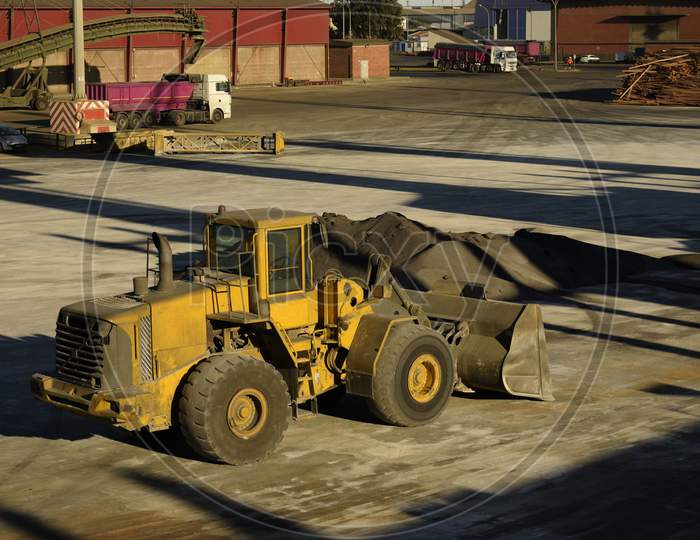 bulldozer making cargo heap
