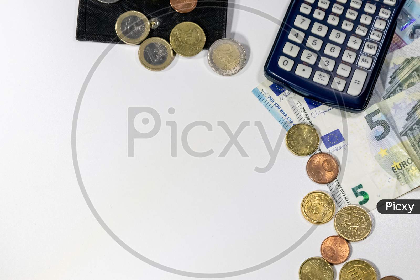 European money with black wallet on white desk as white background with different euro coins and euro bank notes with calculator for financial management and income business plans for tax calculation
