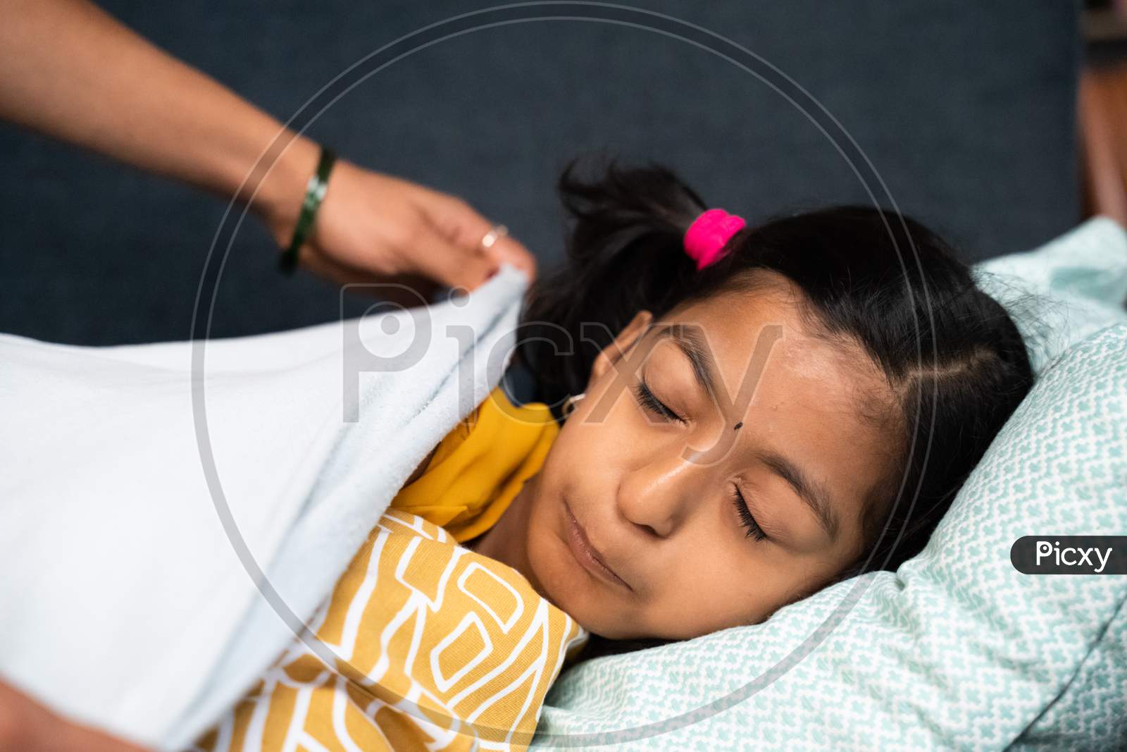 Mother Covering Child With Blanket While Kid Sleeping On Sofa - Concept Of Motherhood, Love Of Mother, Relationship And Bonding.