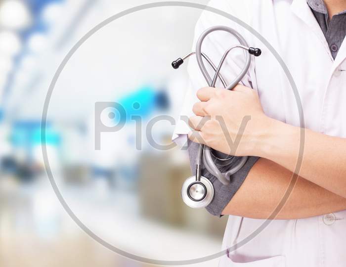 Doctor With A Stethoscope In The Hands And Hospital Background