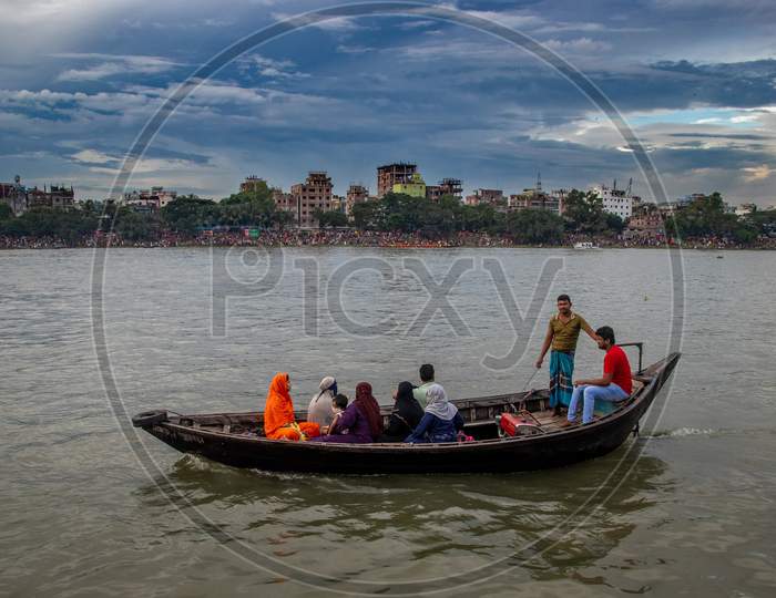 Spectator Of Boat Race Enjoying Under The Cloudy Sky. This Image Has Been Captured On September-28- 2021 From Dhaka, Burigongga River, Bangladesh, South Asia