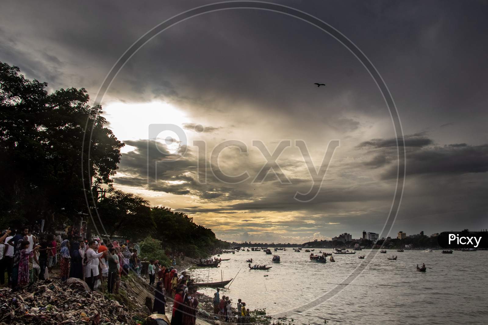 Spectator Of Boat Race Enjoying Under The Cloudy Sky. This Image Has Been Captured On September-28- 2021 From Dhaka, Burigongga River, Bangladesh, South Asia