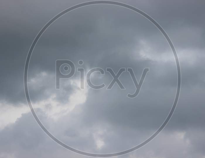 Grey Fluffy Clouds On Cloudy Sky