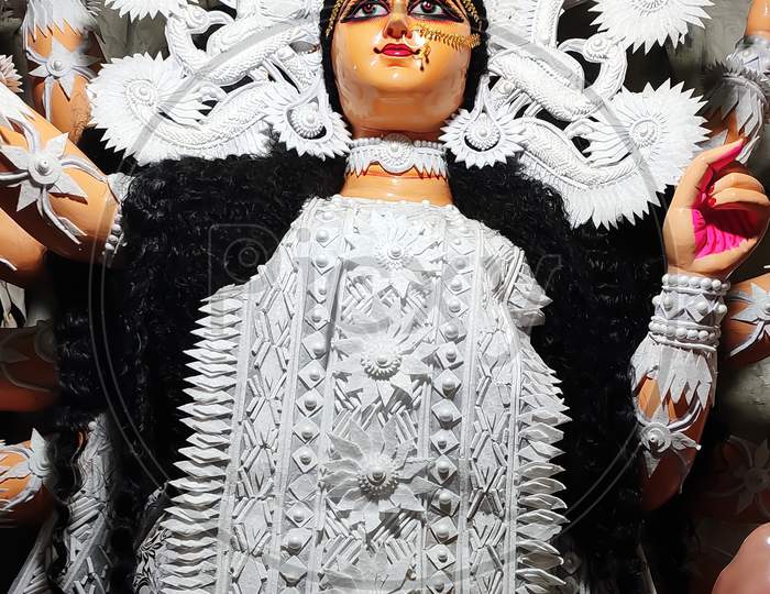 A finished idol of goddess Durga (Dhakersaaj) in Kumartoli during Durga puja in,kolkata, India. Selective focus on face.