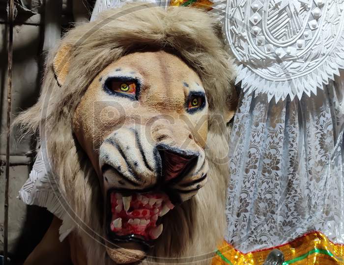 A well crafted face of lion in a Clay idol workshop in Kumartoli during Durga puja in kolkata, India. Selective focus on face.