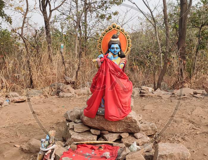 A beautiful sculpture of Lord Krishna being displayed on the top of susunia hill in bankura, West Bengal, India. Selective focus on the idol.