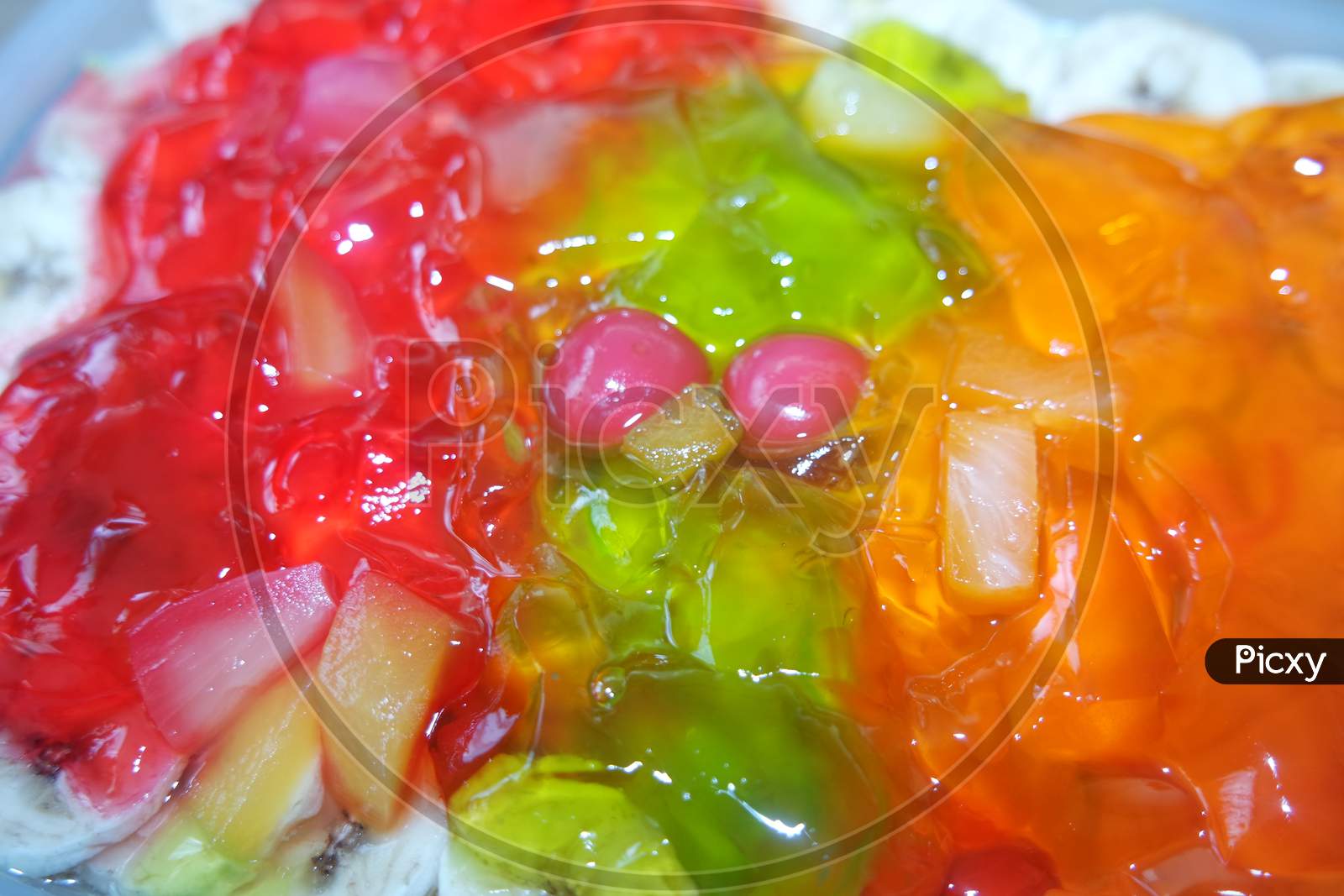 Creamy Custard Jelly Sweet Dish With Different Slices Layered On Surface