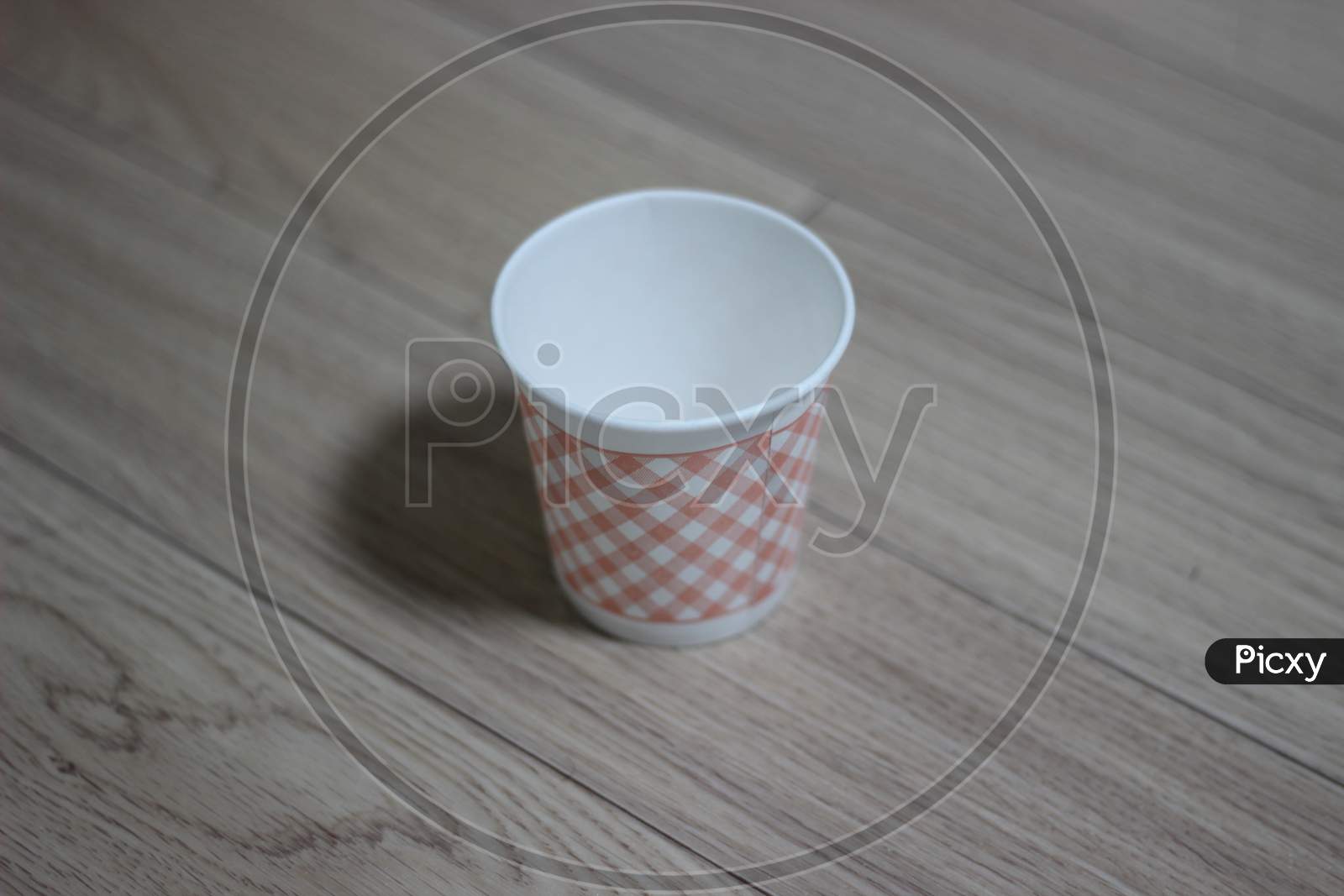 Disposable Paper Cups On The Wooden Floor