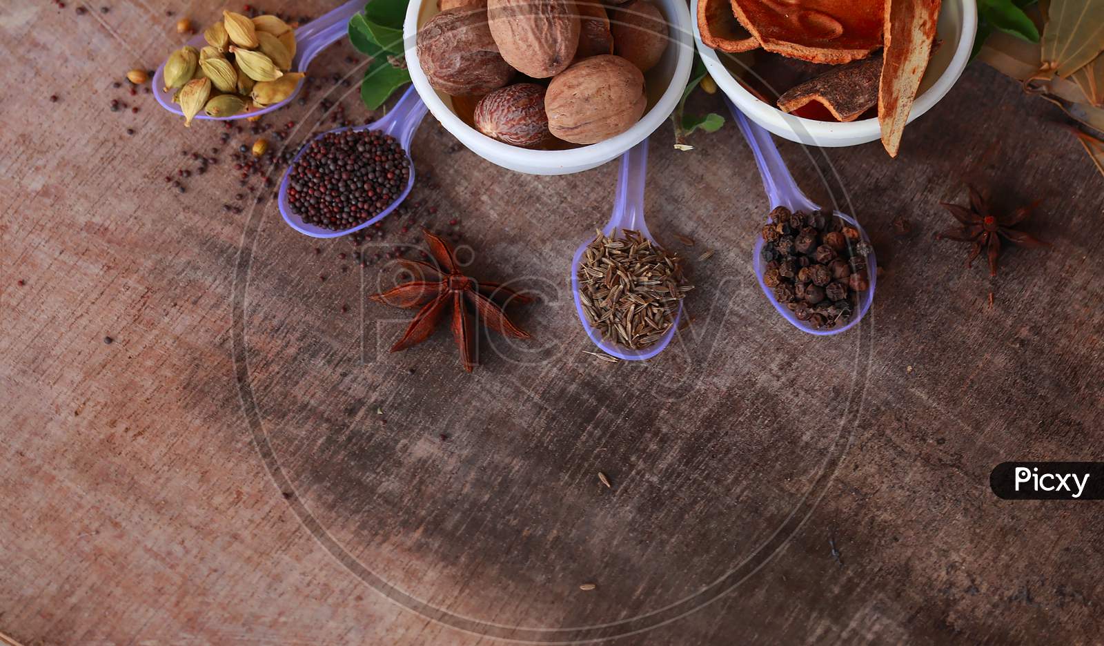 Spice Background, Top View.Rotation All Indian Spices On Wooden Table,Indian Cuisine,Cumin, Black Pepper, Cloves, Cardamom, Fennel, Bay Leaf,Background Rotating,