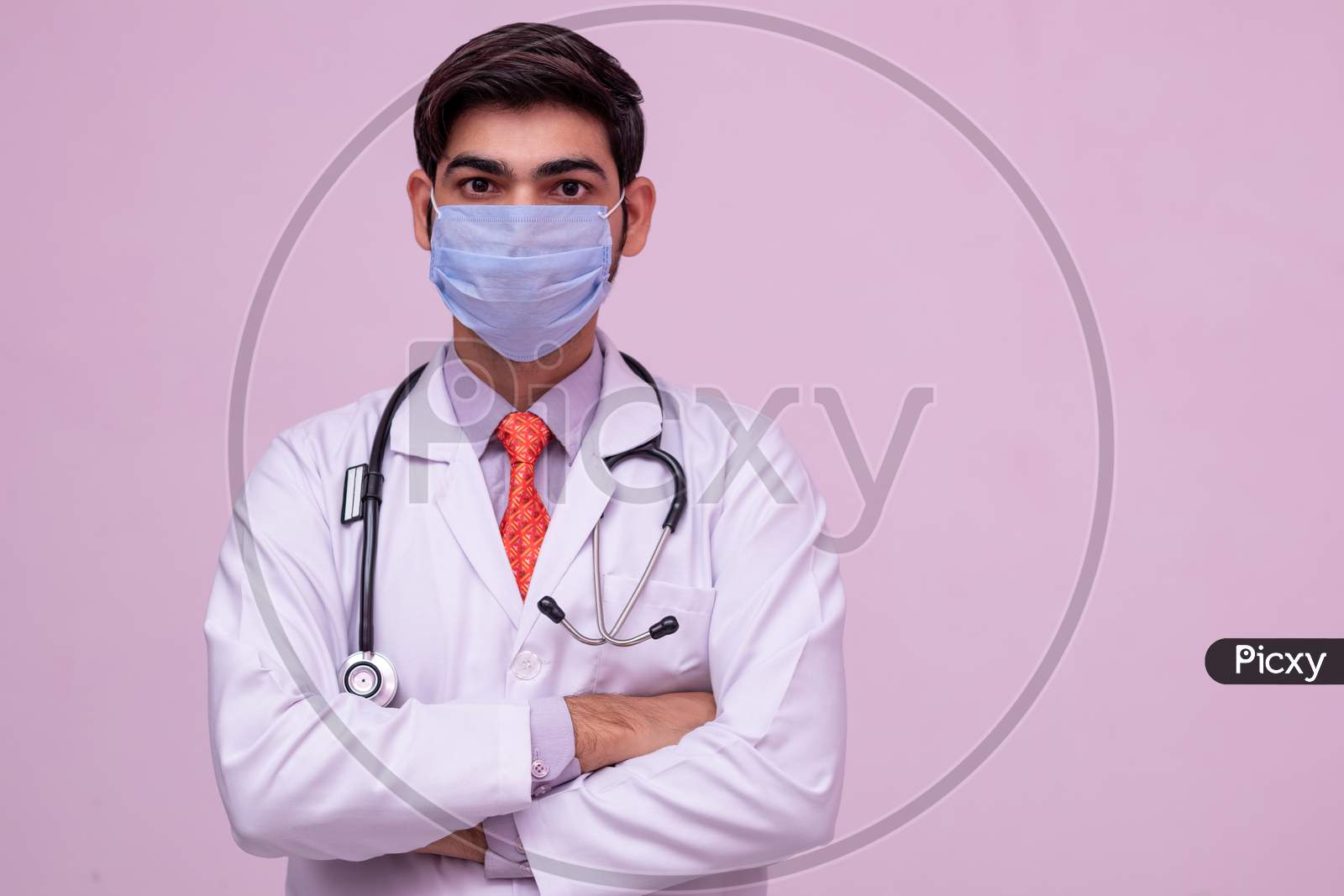 Doctor Wearing Medical Mask On Isolated Background.