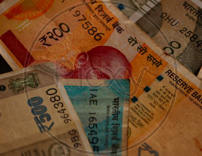 India Money On The Rotating Table,New Indian Currency 2000-500-200-100-50-10 With Wooden Background,New Indian Paper Currency