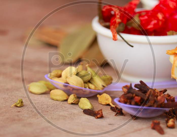 Variety Of Spices And Herbs On Kitchen Table,Cooking Ingredients,Spices And Seasonings For Cooking,Neroli,Nutmeg, Cinnamon, Cloves, Anise,Cardamom