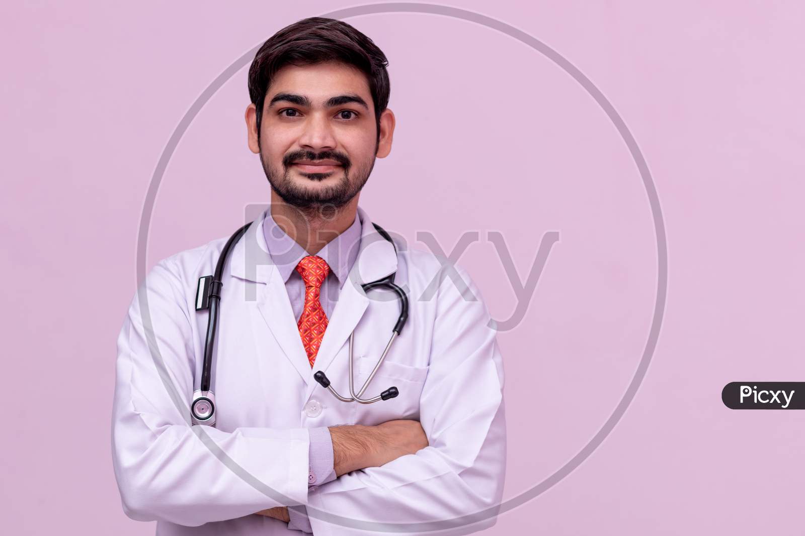 Young Male Doctor Look At Camera And Smiling.