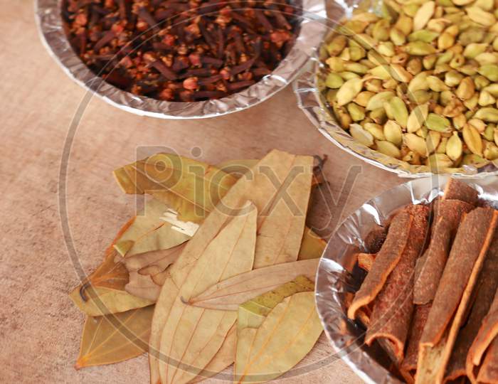 Spices And Herbs In White Bowls, Spice In Small Spoon,Food And Cuisine Ingredients,Various Spices Collection,Food Background,Turmeric, Star Anise,Mace,Cloves
