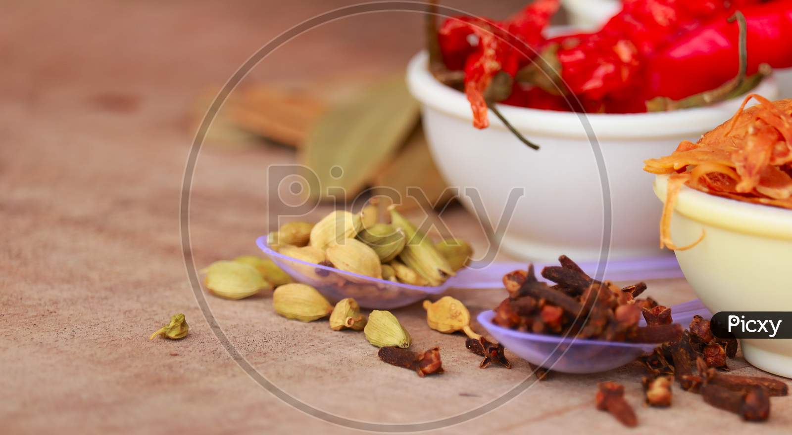 Variety Of Spices And Herbs On Kitchen Table,Cooking Ingredients,Spices And Seasonings For Cooking,Neroli,Nutmeg, Cinnamon, Cloves, Anise,Cardamom