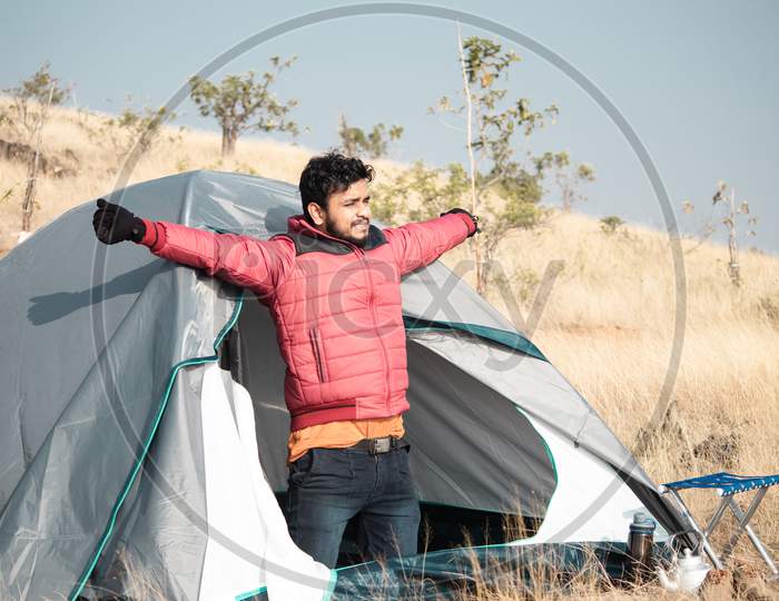 Traveller Waking Up From Camping Tent At Morning On Top Of Mountain - Concept Of Solo Travel, Wanderer During Holidays And Vacation