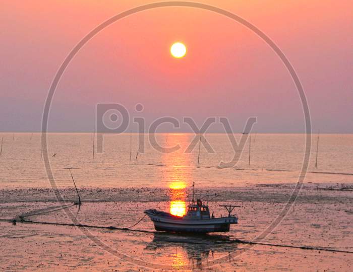 Fishing Boat And Sunset