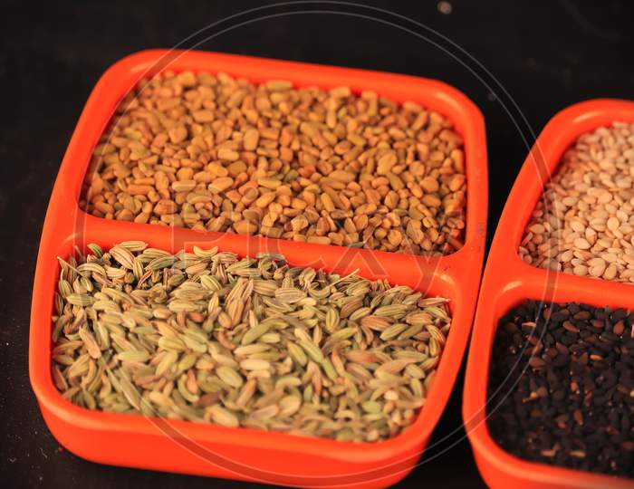 Fenugreek And Anise(Dill) In A Oregon Small Plates Close Up View,Fenugreek Seeds On Plastic Plate,Spice,Aniseed (Pimpinella Anisum),Aniseed